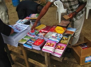 Customers browse the book table in front of a church in Jos, Nigeria.