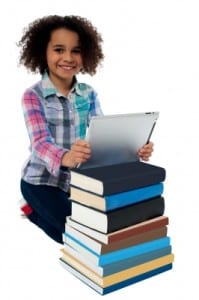 Smiling girl with books and tablet Freedigitalphotos